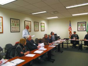 In this 2015 file photo Greene County Emergency Services Director John Farrell (standing) explains the grants applied for and awarded to Greene County to the legislature.
